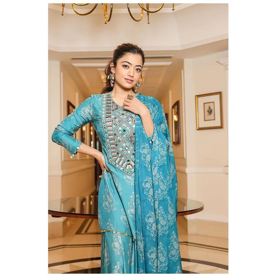 If you don`t want to hassle with dressing up in a saree for Diwali pooja, Rashmika`s simple blue suit with heavy embroidery maintains the festive vibe