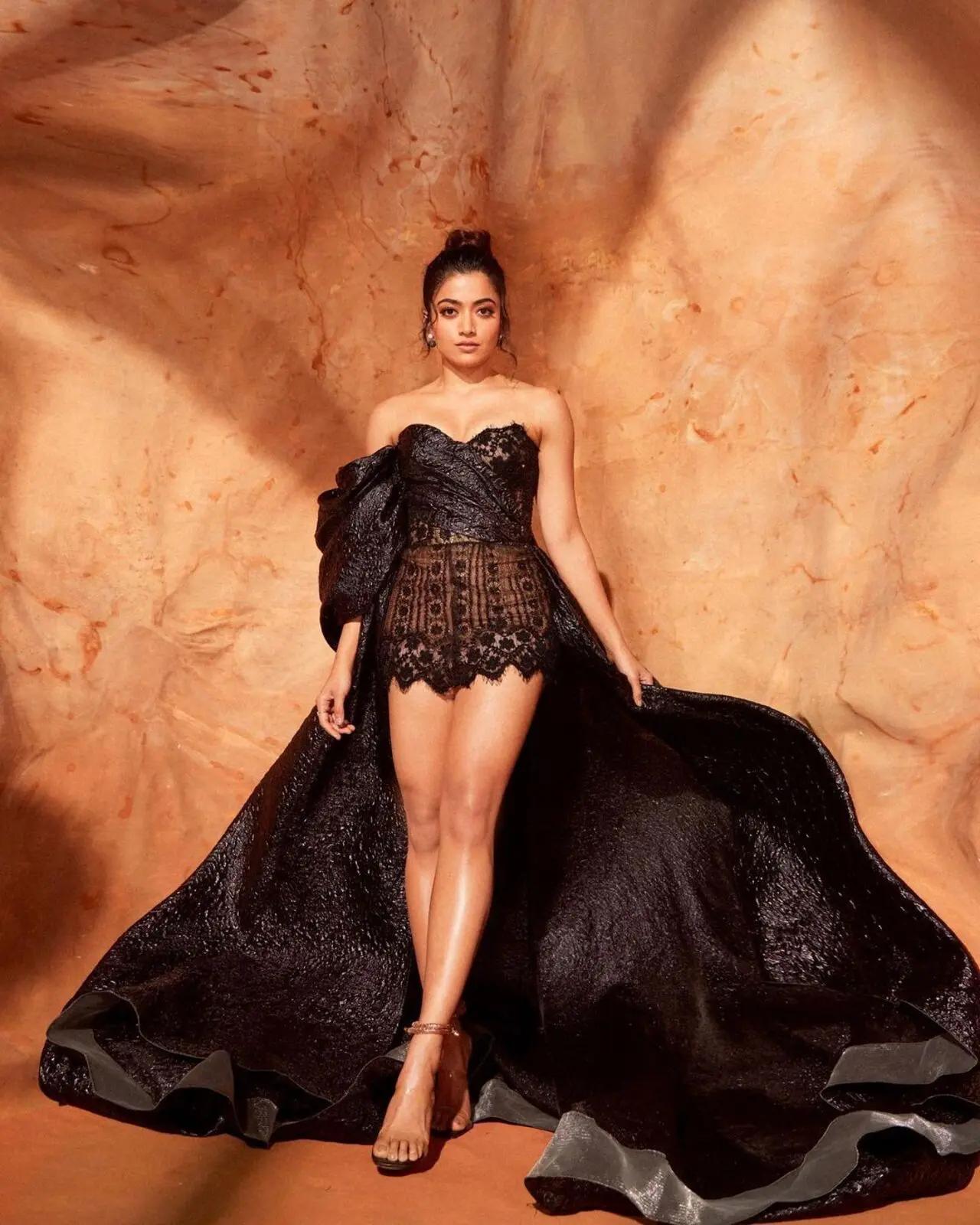 Bringing drama to the floor, Rashmika cast black magic with this voluminous gown. The outfit with lace details came with a long trail