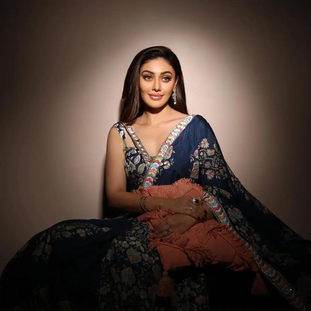 You can never go wrong with stunning lehengas, and the actress proves it with this blue heavily decorated outfit