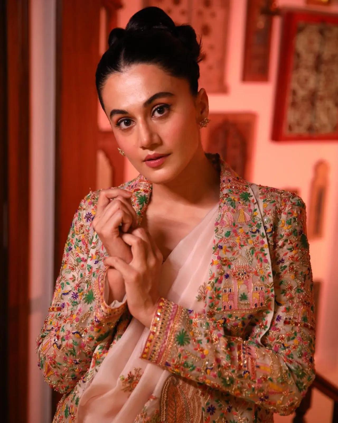 The actress tied her hair in a chic bun and completed her look with nude makeup