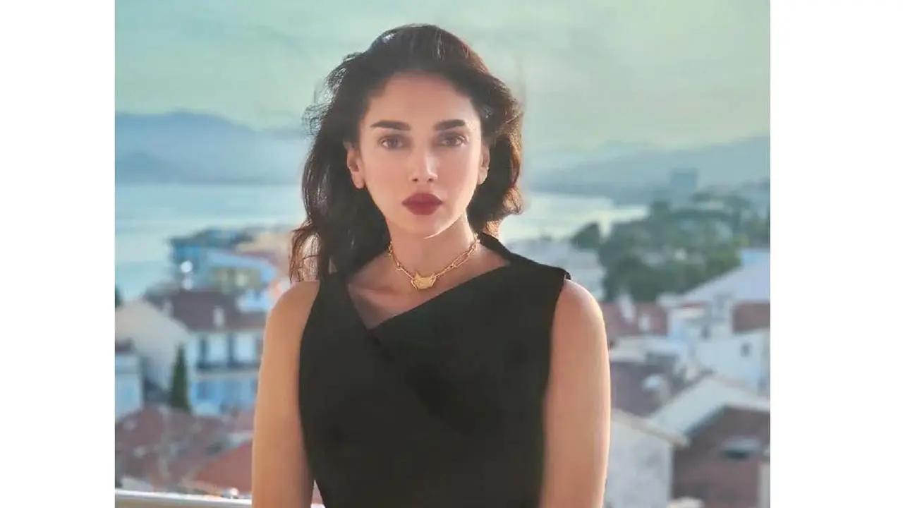 She was seen taking a tour of the charming streets at Cannes in a little black dress with a short hem.