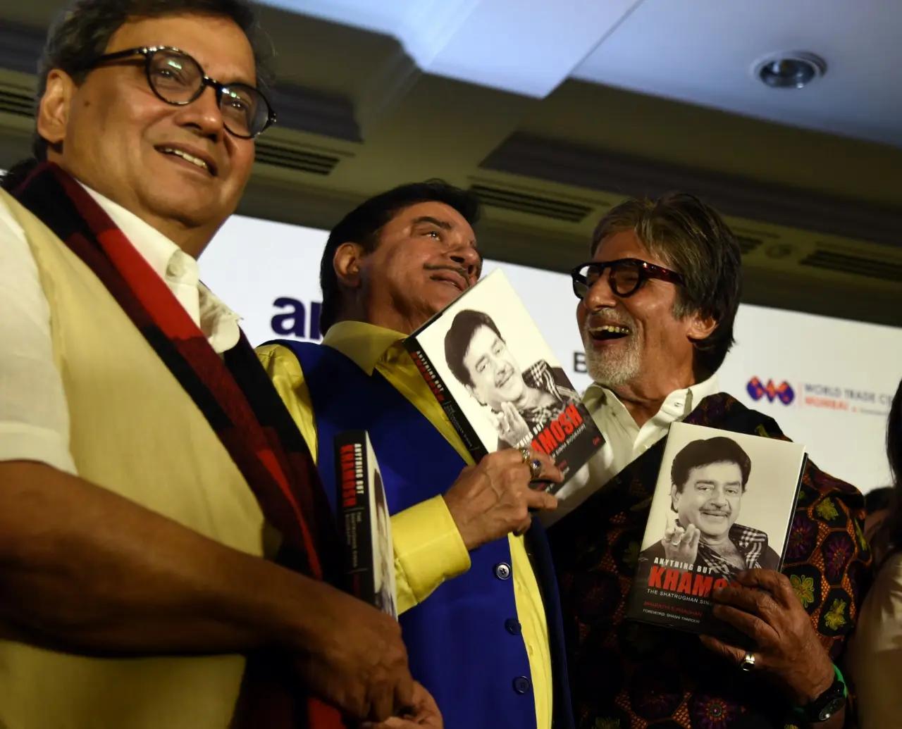 At the book launch of Shatrughan Sinha`s autobiography, Amitabh Bachchan shares a light-hearted moment with the actor on stage. Seen in the frame is also director Subhash Ghai
