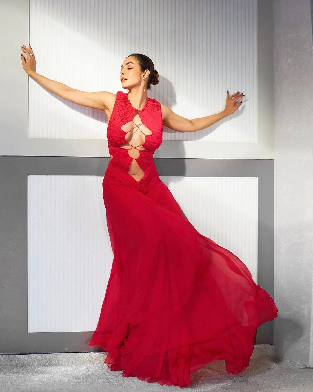 The gown had elaborate cuts on the front revealing her toned midriff.