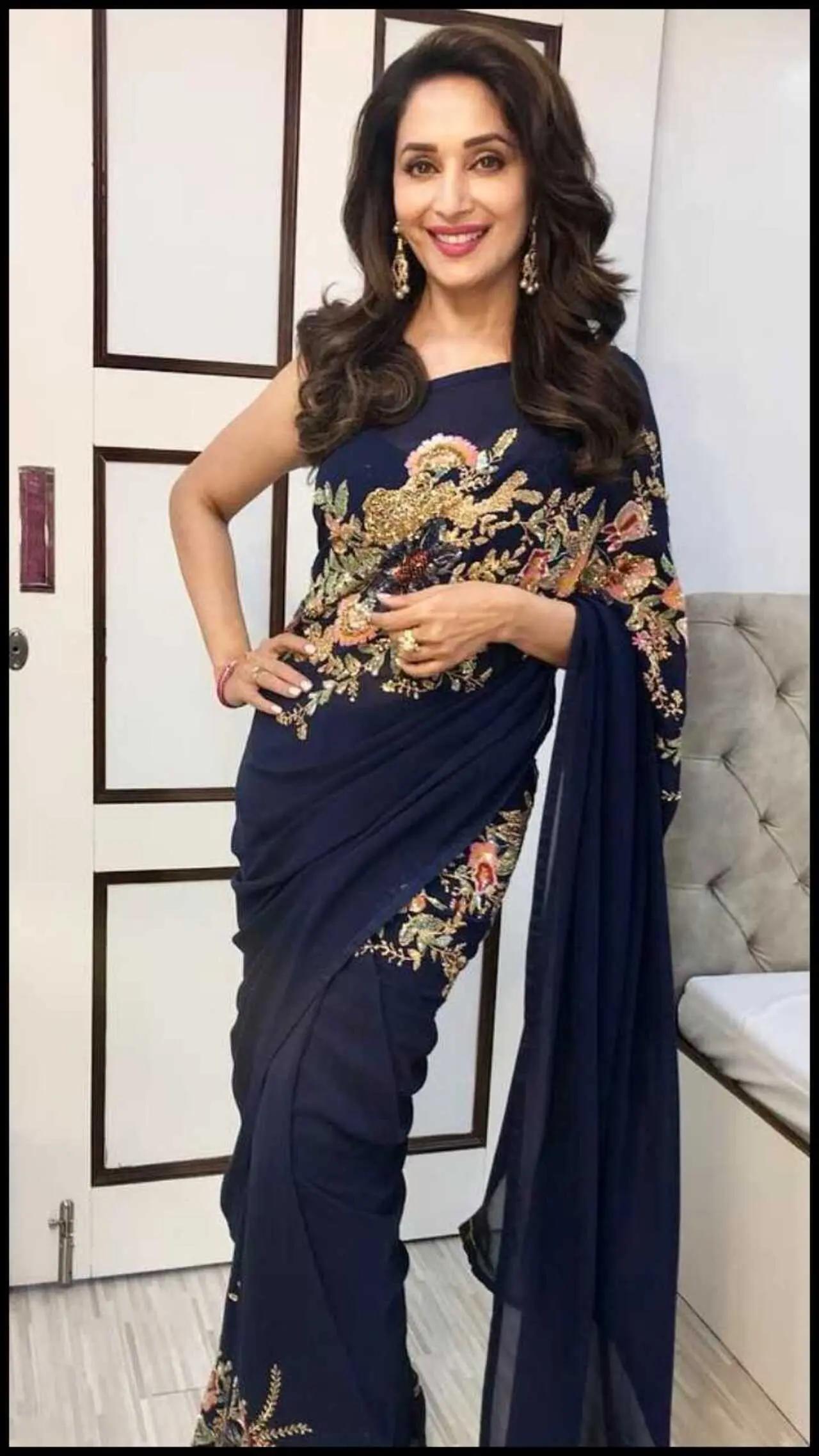 Madhuri Dixit`s blue saree with golden embroidery is perfect for the festive season