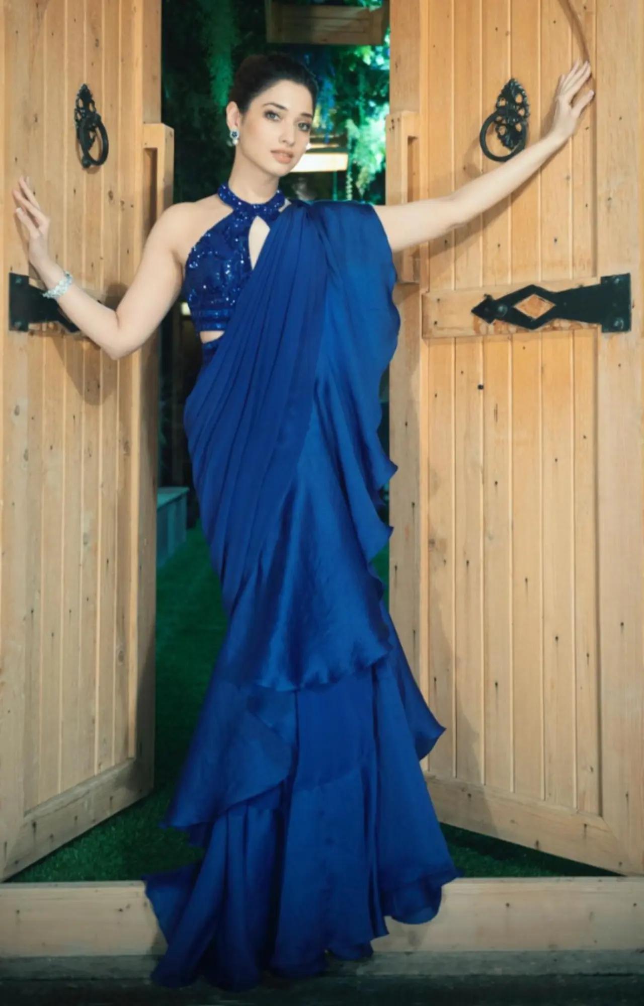 Tamannaah Bhatia`s simple blue saree with halter neck blouse is perfect for the festive season