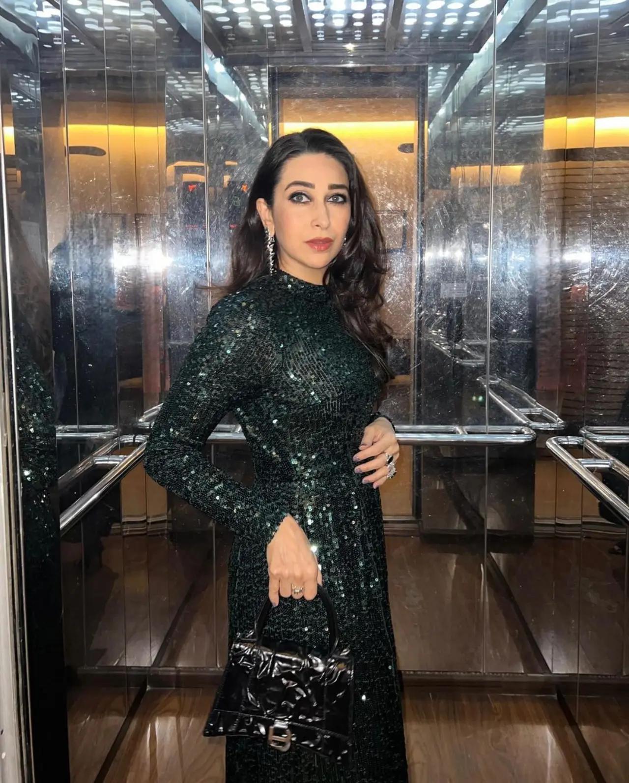 Karisma Kapoor opted for a shimmery green gown to dance the night away at her `Dil Toh Pagal Hai` co-star`s birthday