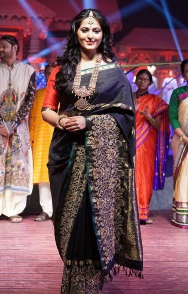 Anushka Shetty`s saree looks are nothing short of regal. Known for her role as Princess Devasena in Baahubali, she often dons rich handloom fabrics.
