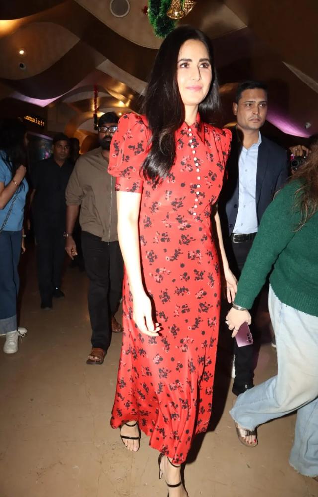Actress Katrina Kaif dressed in a red dress with floral prints, in keeping with her character from the film