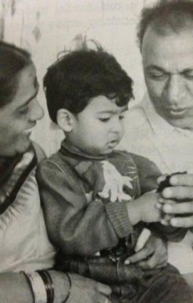 Puneeth Rajkumar, affectionately known as Appu, has adorable childhood photos where he is seen with a cheerful expression and curly hair.