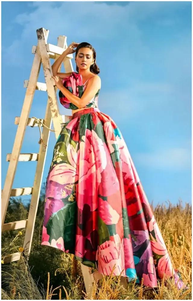 Actress Sanvikaa, who plays Rinki, is seen in an over the top floral printed gown