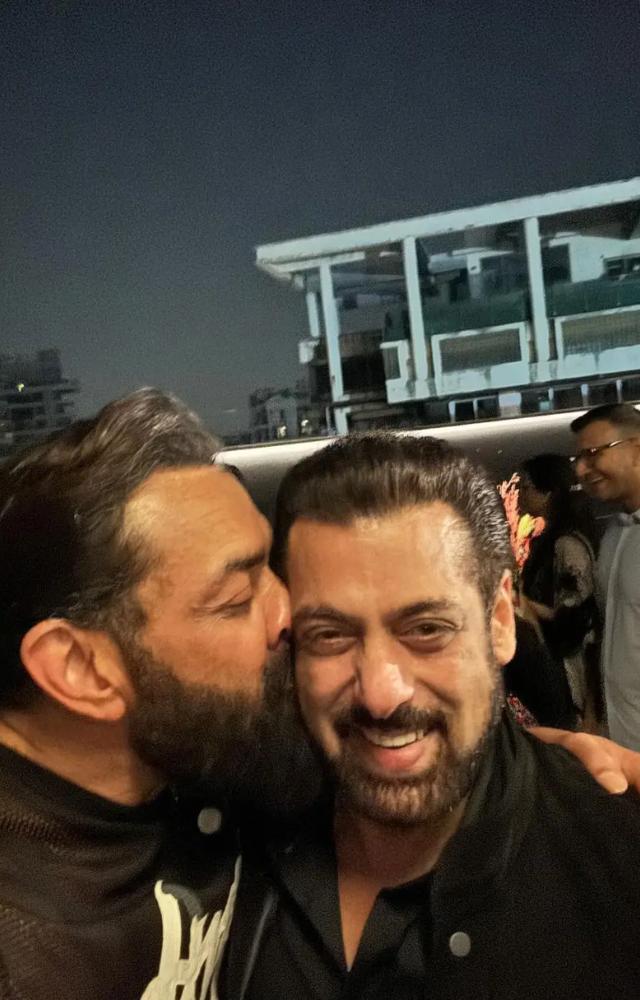 Bobby Deol affectionately pecked Salman Khan on the cheek