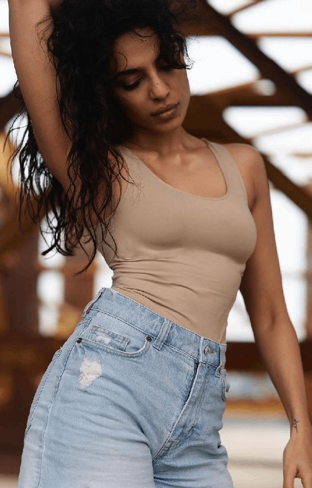 Shobita elevated her attire by complementing it with wavy hair and white sneakers, adding a touch of stylish and elegant, she rocks in her denim shorts