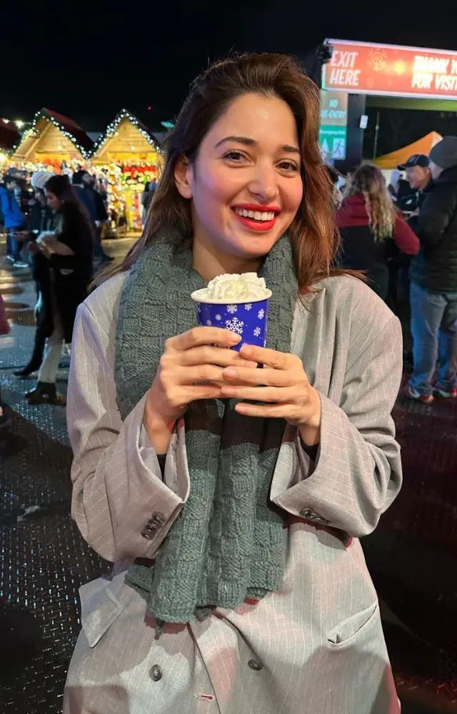 The `Himmatwala` actress grins in this photo as she holds a beverage in her hand