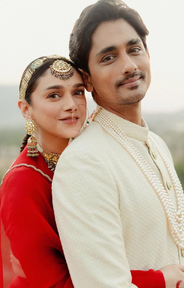 Aditi Rao Hydari and Siddharth dropped some new wedding pictures, and they`re breathtaking. The couple looks beautiful in a red and white ensemble.