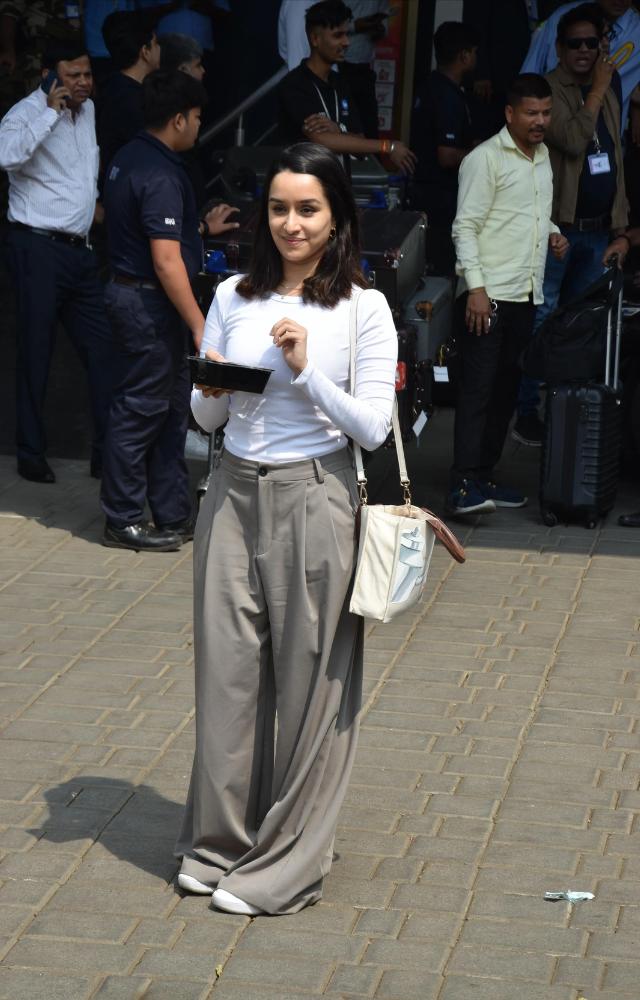 Shraddha, another Bollywood star, turned heads with her airport attire, comfortable yet stylish, ideal for travel.