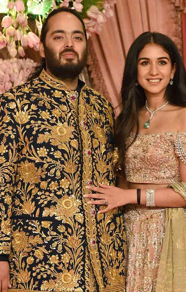 Anant Ambani, the groom-to-be, radiated regal charm in a midnight blue bandhgala adorned with intricate Persian garden motifs, featuring real gold zari
