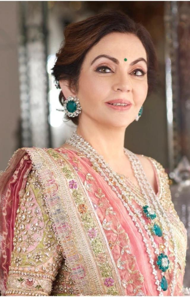 Nita Ambani elegantly donned an ivory Manish Malhotra lehenga with vintage zardosi embroidery and a Banarasi tissue dupatta.