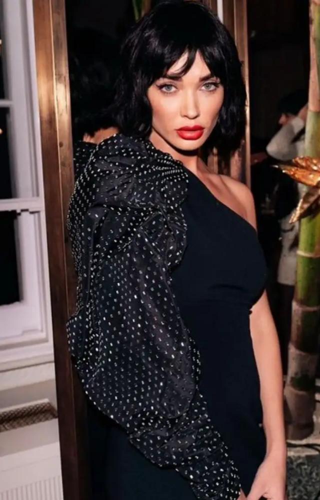 Amy frequently opts for the classic Little Black Dress (LBD), styling it impeccably for any event, showcasing elegance and sophistication.