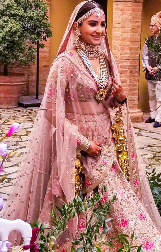 Step into the world of Anushka Sharma`s dreamy bridal outfits, capturing hearts with her simplicity and sophistication.