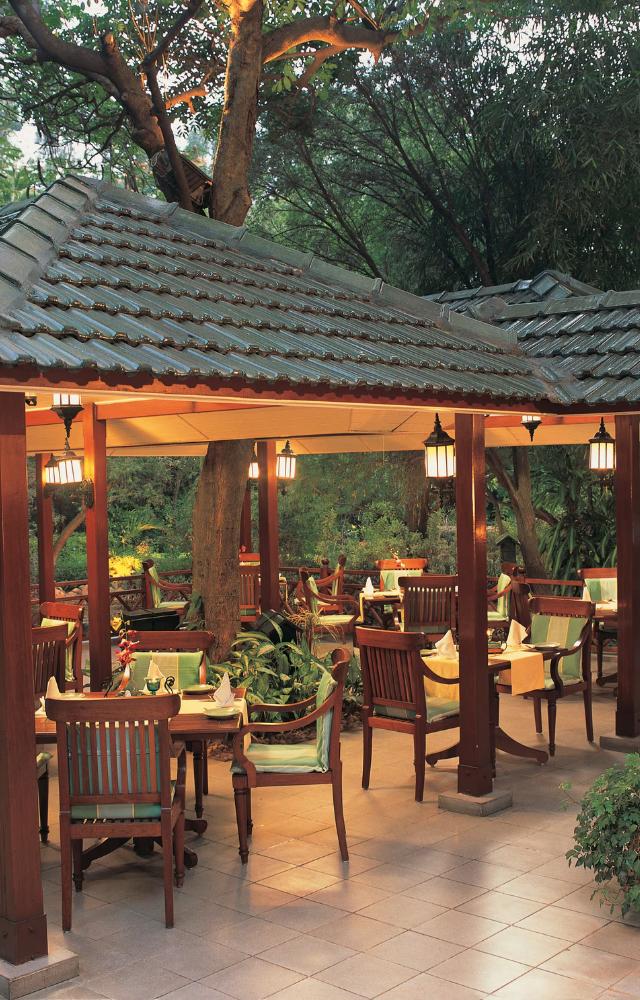 Offers a stunning ambiance with a view of the cityscape and serene outdoor seating. Perfect for a luxurious dining experience