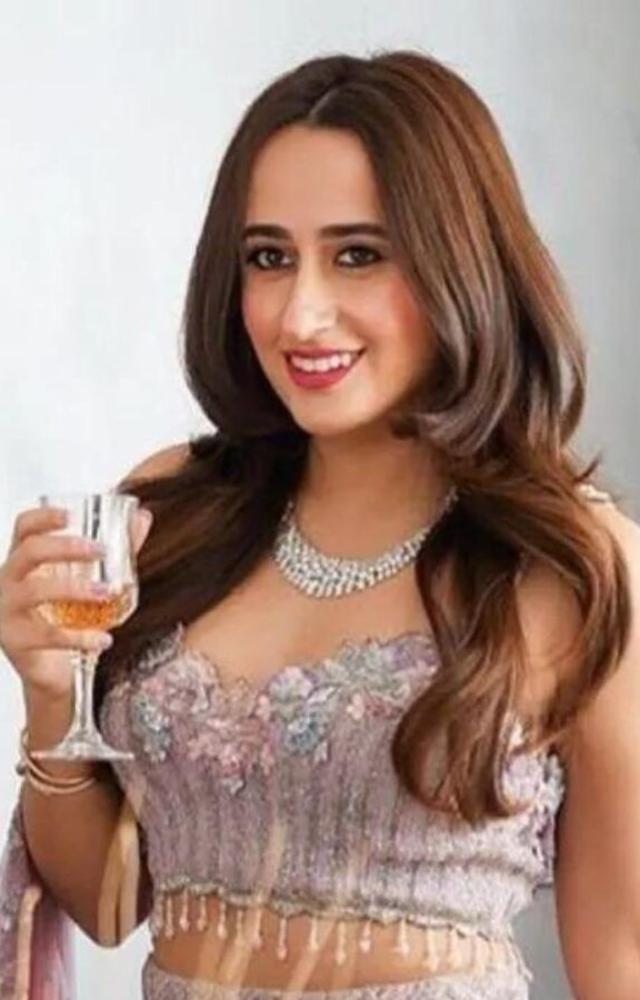 A fashion designer. She has her own label and keeps a relatively low profile despite her husband`s stardom.