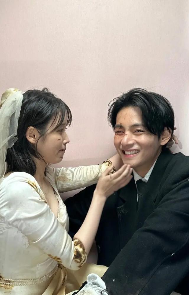 Taehyung and IU shared some behind-the-scenes photos from the music video shoot, which showed them get all cute and goofy with each other.