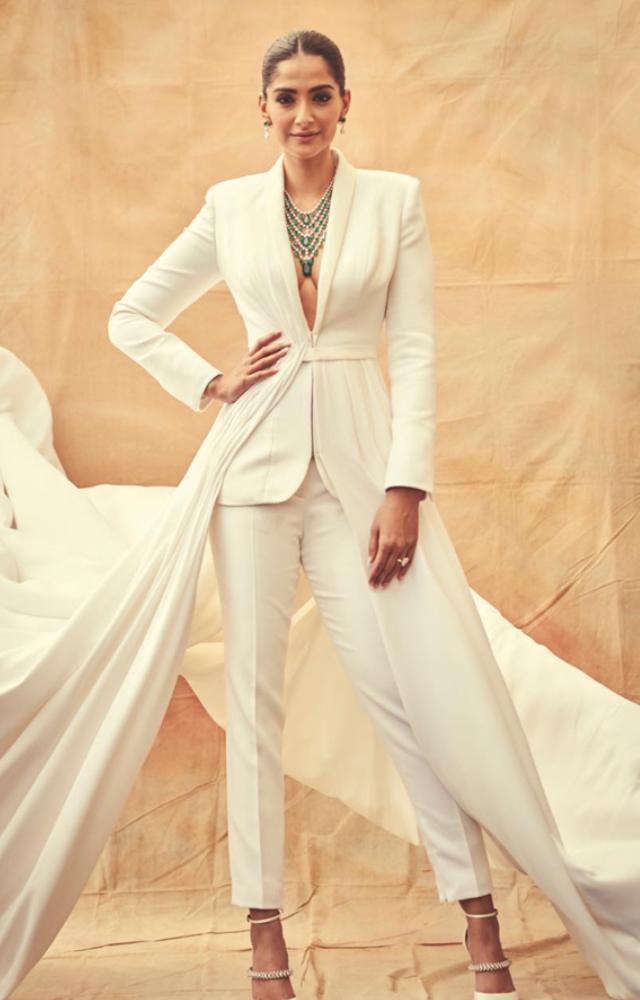 This bold and unconventional take on a tuxedo with a flowing train showcased her experimental and high-fashion sensibilities.