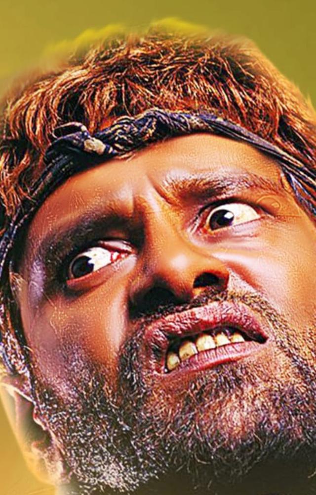 A mentally challenged man in `Pithamagan`, demonstrating his exceptional acting prowess.