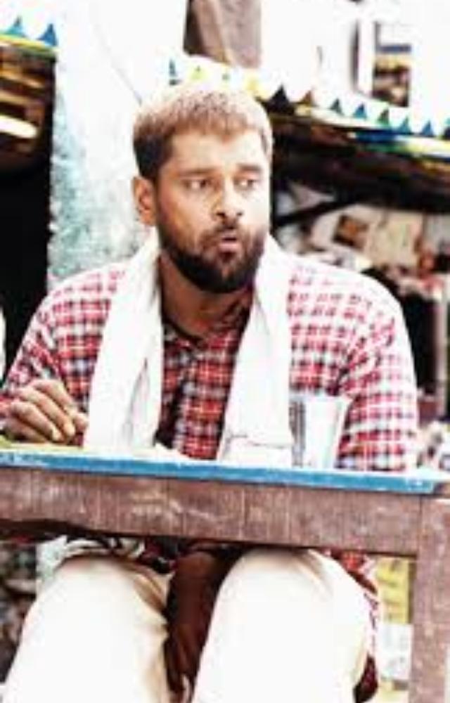 A socially isolated gravedigger who finds unexpected friendship, highlighting Vikram`s nuanced portrayal of innocence and raw emotion.