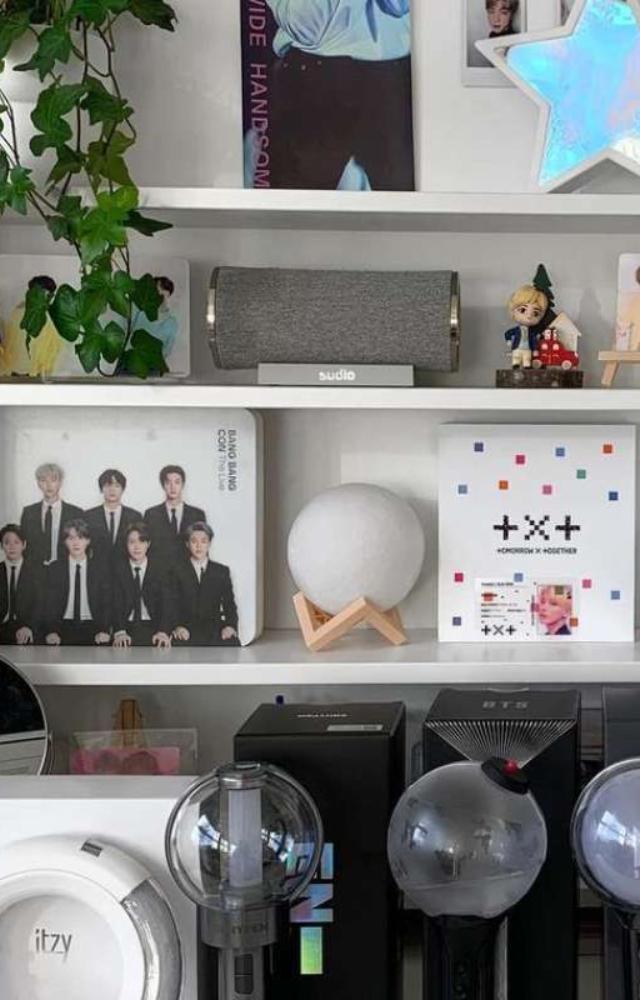 This could be anything from a poster or photocard of their favourite idol or actor/actress to a t-shirt or keychain with their favourite group or drama logo.