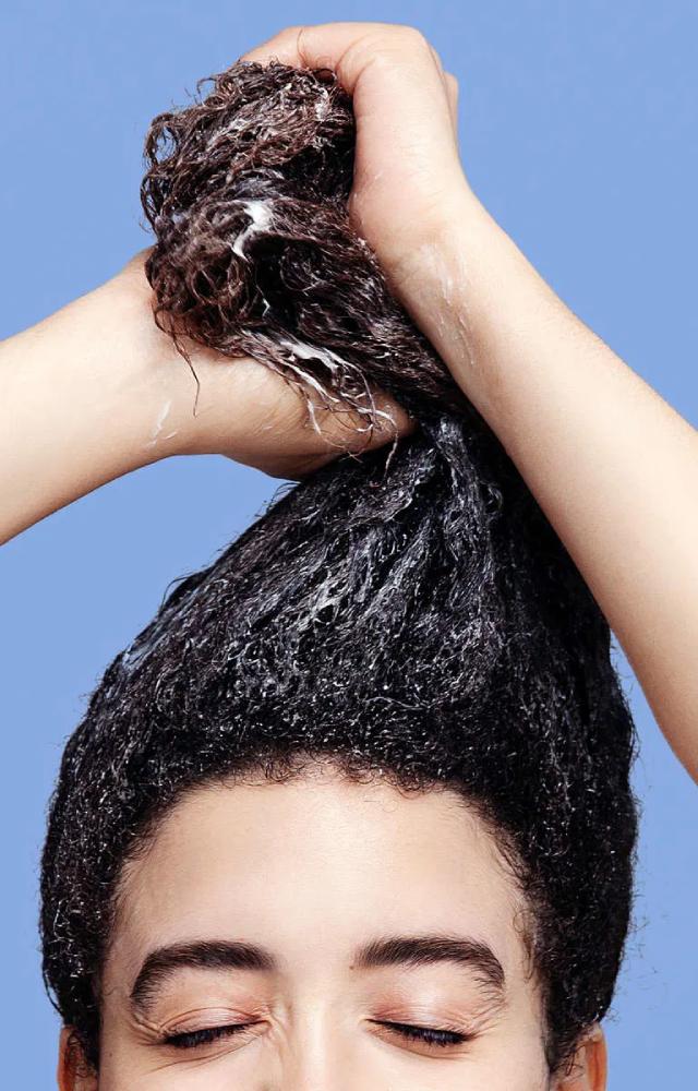 Apply your leave-in conditioner, serum, or curl cream when your hair is damp—not soaking wet. It helps lock in moisture without diluting the product.