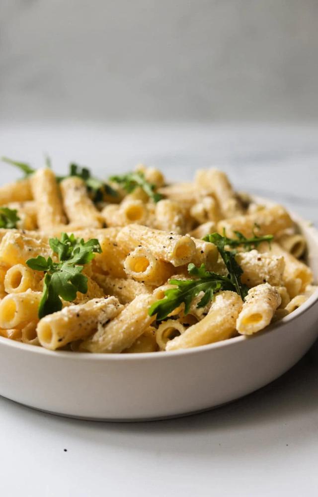 Mix cooked penne with creamy ricotta, lemon zest, and juice. Add olive oil, black pepper, and a sprinkle of Parmesan for a zesty, creamy delight.