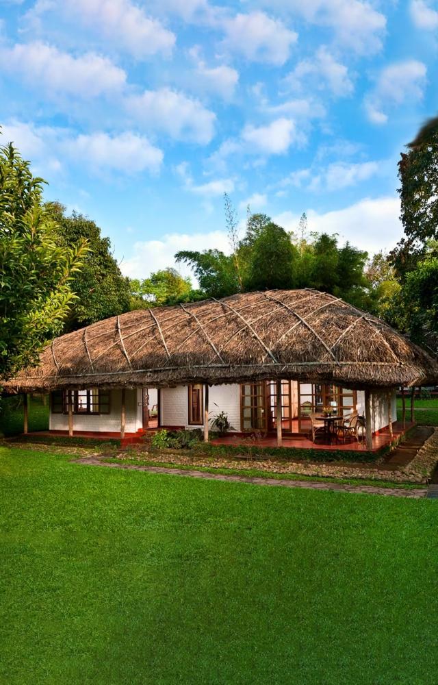 Modeled like a tribal village, it uses local materials and promotes sustainable practices amidst spice plantations.