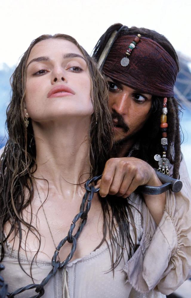 As Elizabeth Swann in The Curse of the Black Pearl, she evolves from a refined lady to a spirited adventurer alongside pirates.