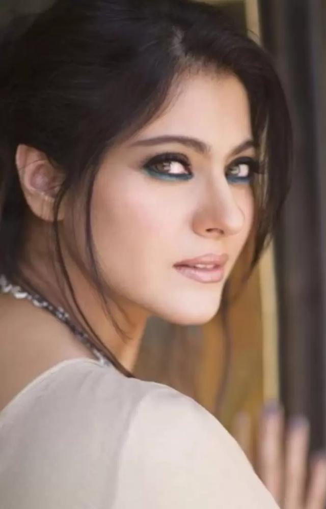 Kajol`s makeup style in movies like 'Kabhi Khushi Kabhie Gham' featured bold eyeliner and red lipstick, giving her a striking appearance.