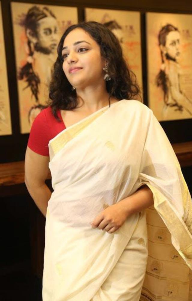 She has chosen a natural, minimalistic makeup look that beautifully highlights her natural beauty and graceful features.