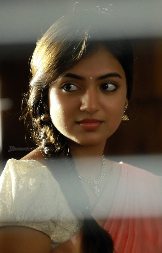 Her portrayal of Divya Prakash Kumar in this romantic drama showcased her natural chemistry with Nivin Pauly, creating many heartwarming moments.