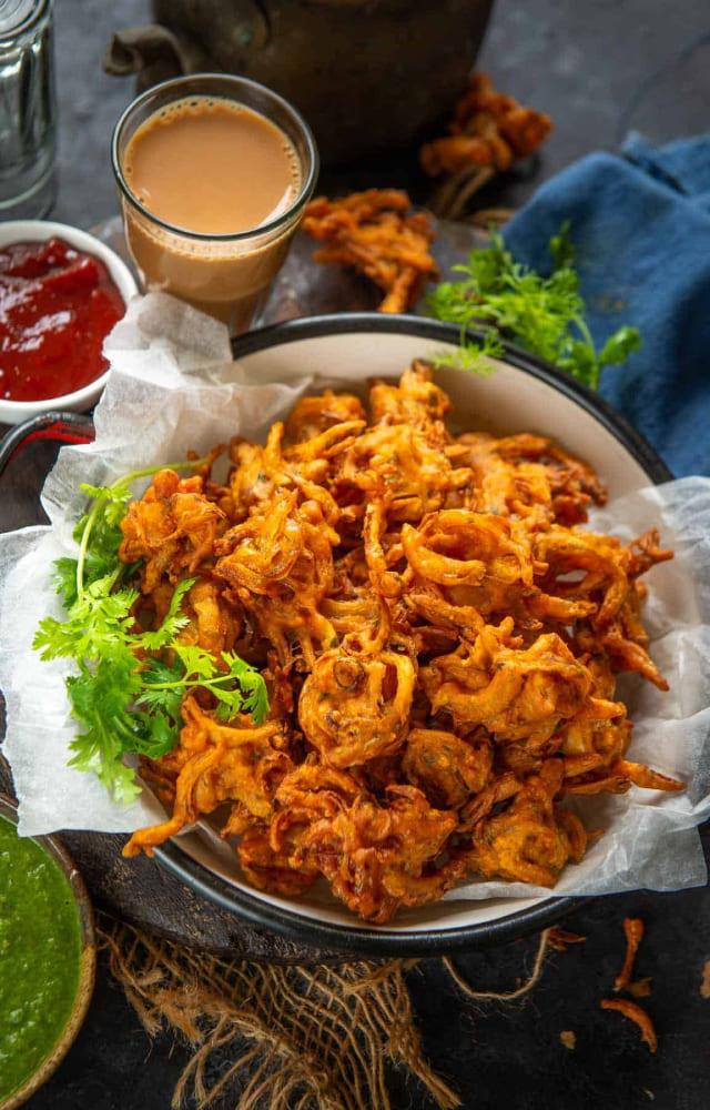 One of the most popular street foods in Mumbai, Kanda Bhajji or Onion Pakora, is a must-have on a rainy day. Pro tip: add some rice flour for extra crispiness.