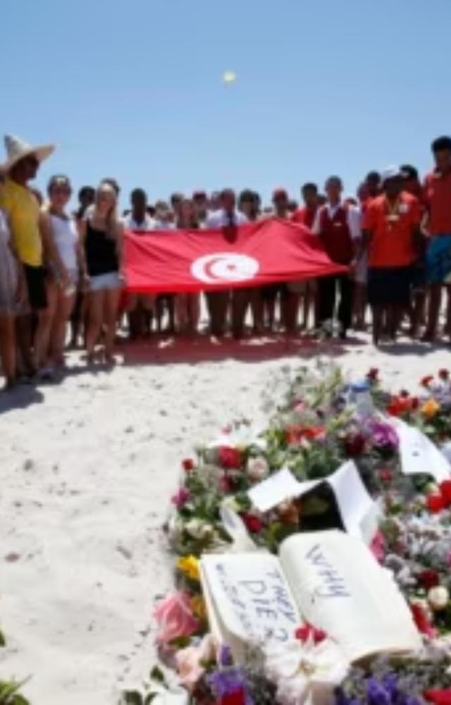A gunman killed 38 tourists, mostly British, at a beach resort. This attack specifically targeted tourists in a leisure setting.
