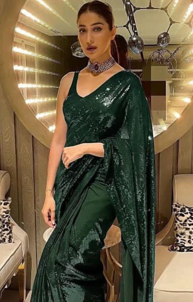 Raai Laxmi showcases various draping styles that complement her figure and enhance the saree`s appeal.