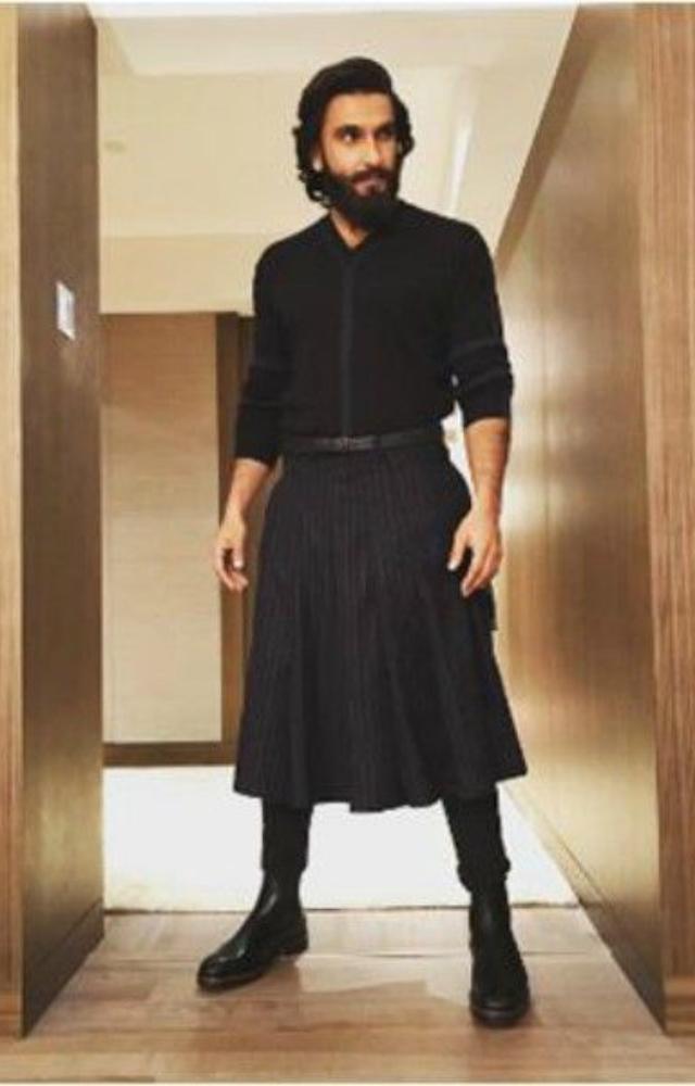 Ranveer Singh defies gender norms, frequently seen in skirts, ornate robes, and high heels, showcasing his unique fashion choices.