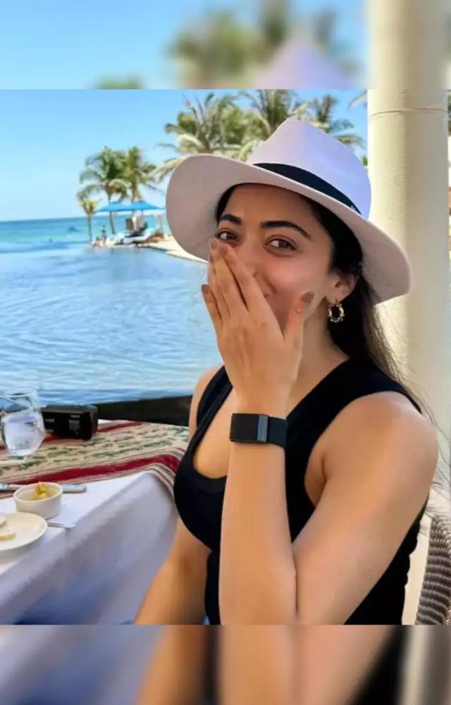 Rashmika shared dreamy beach photos from her birthday celebration in Oman, featuring radiant sunsets and her cheerful vibes.