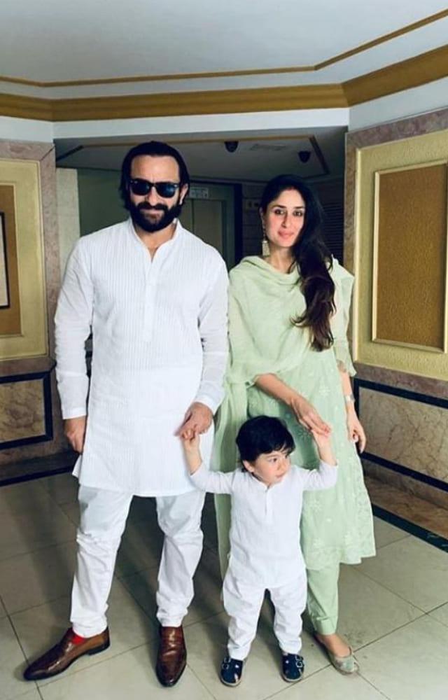The Khans look a vision in white as they pose in ethnic wear for a festive celebration. Taimur and Saif Ali Khan are twinning in white outfits and black shoes.