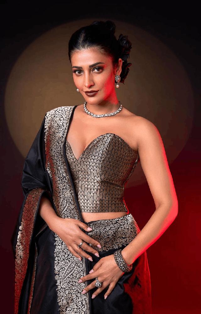 Shruti Haasan celebrating 38th birthday, she looks grace in a silk black saree adorned with silver embroidery, paired with a corset-style blouse by Ekaya