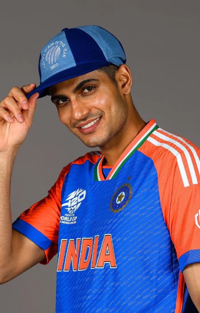 India`s opener flaunts his new jersey and cap in style. India`s T20 World Cup 2024 jersey is vibrant blue with the tricolor on the collar.