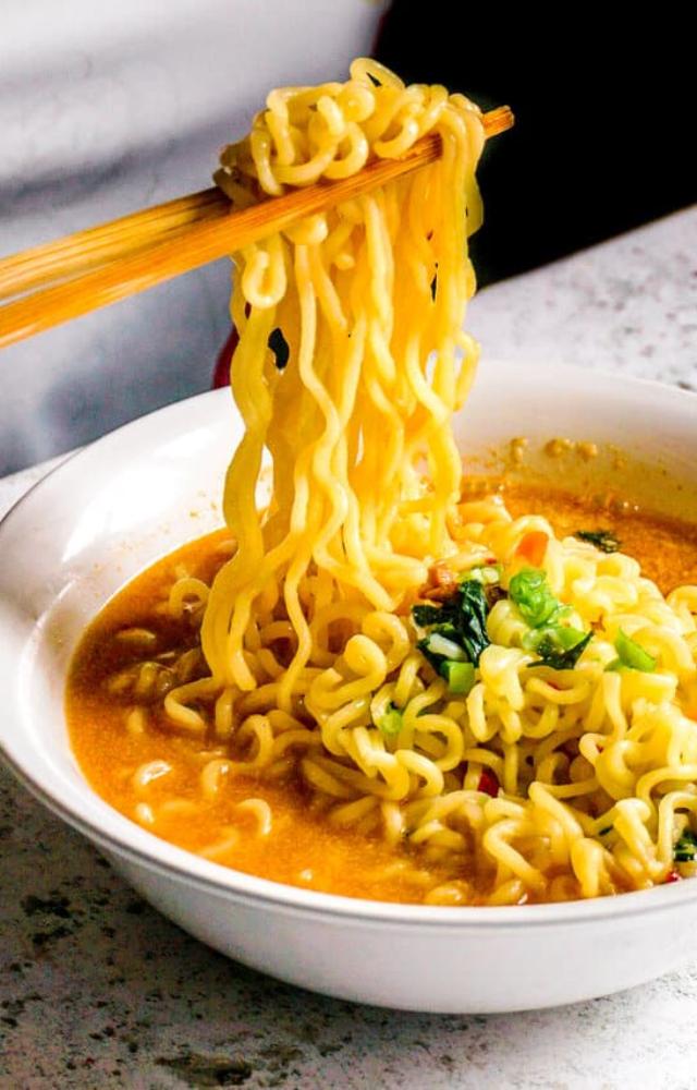 The combination of high carbs, unhealthy fats, and low fiber in instant noodles can lead to weight gain and obesity over time.