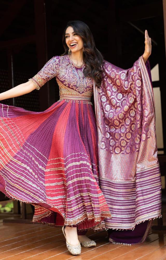 Why go for boring colours when you can add brighter hues to your wedding wardrobe? Sobhita looks simply gorgeous in this pink and purple-hued lehenga.