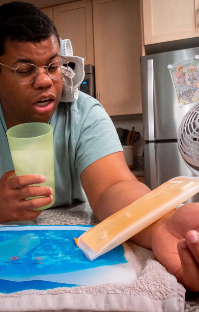 Run cold water over your wrists or apply a cool, damp cloth to your neck and temples. Cooling these areas quickly lowers overall body temperature.