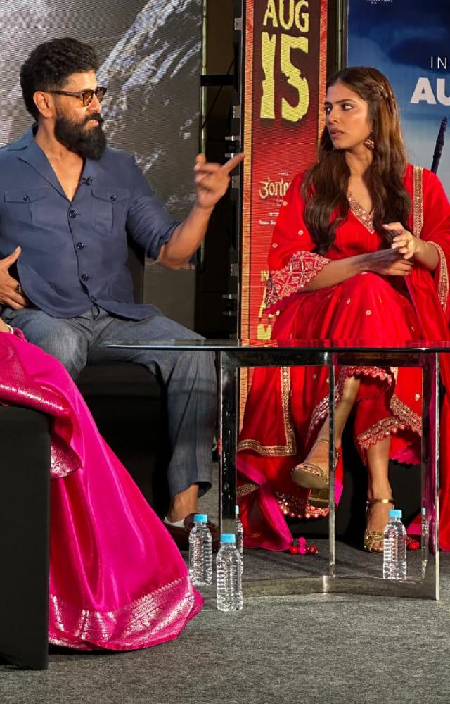 The Ponniyan Selvan actor looked dapper in a blue shirt paired with denims, while Malvika exuded elegance in a red ethnic suit.