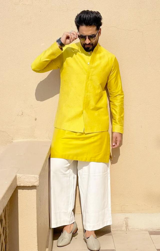 This vibrant ensemble, perfect for a friend`s haldi ceremony, showcases Jackky`s ability to stand out in the crowd with his sartorial choices.